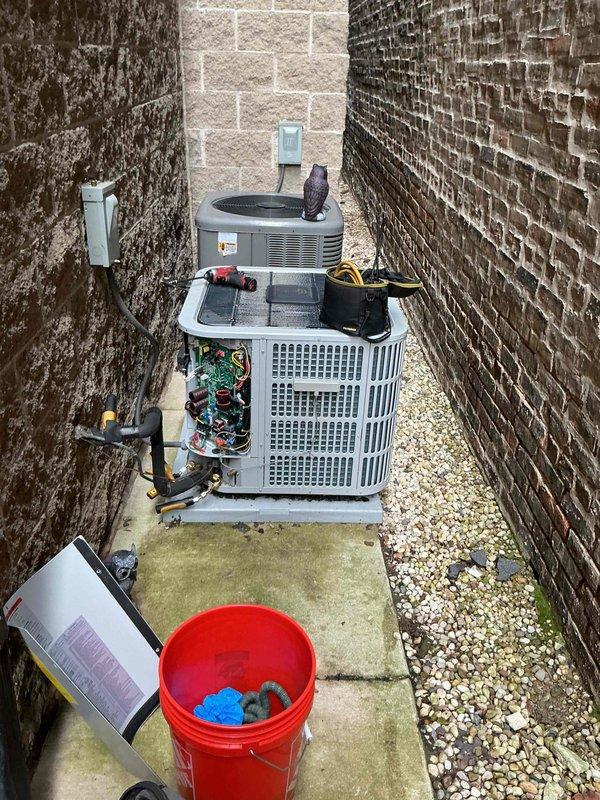 Performed comprehensive Comfort Plan clean and check maintenance on single HVAC system located in confined outdoor space between buildings. Completed thorough inspection of both condensing units, verified proper operation of all components, cleaned coils and checked refrigerant levels, tested electrical connections and controls, and documented system conditions with photos. All equipment found operating within normal parameters with no immediate service needs identified.