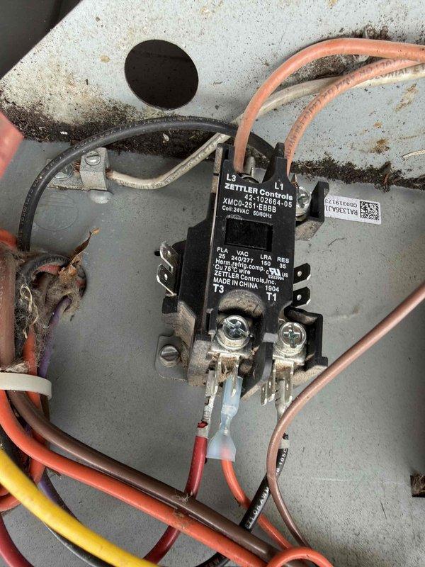 Responded to service call for Nest thermostat displaying error code on dual-system installation serving upper floor. Performed diagnostic inspection of affected AC unit, locating outdoor condensing unit with Zettler Controls contactor (model XMCO-251-DBBB, 208-240V). Inspected electrical control panel, verifying contactor operation, run capacitor condition, and all wire terminations including power and control wiring. Documented equipment condition showing normal wear and minor surface corrosion on enclosure. Presented maintenance options for both AC systems and comfort plan membership covering multiple HVAC units.
