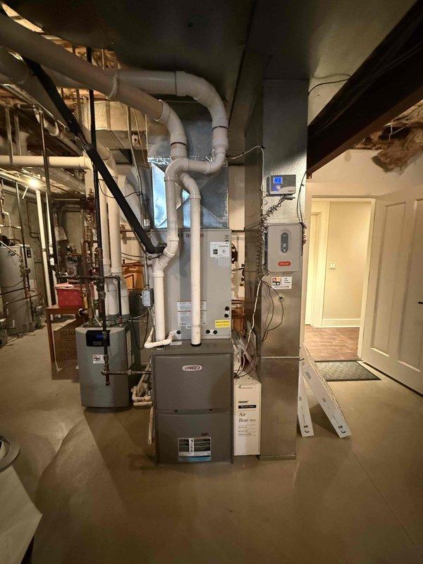 Completed comprehensive clean and check maintenance service on dual HVAC system including two air conditioning units and replaced two 20x25x4 media filters per comfort plan agreement. Performed thorough inspection of indoor Lennox furnace system in basement mechanical room and outdoor condenser unit, verifying proper operation of all components, refrigerant levels, electrical connections, and airflow efficiency to ensure optimal system performance for the upcoming cooling season.