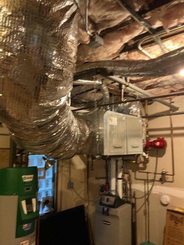 Performed comprehensive clean and check maintenance on single HVAC system including outdoor condensing unit and indoor air handler components. Inspected outdoor unit positioned in side yard, verified proper airflow through condenser coils and fan operation, checked refrigerant levels and electrical connections. Evaluated basement-mounted air handler, ductwork insulation integrity, and associated piping systems to ensure optimal system performance and efficiency per comfort plan maintenance protocol.