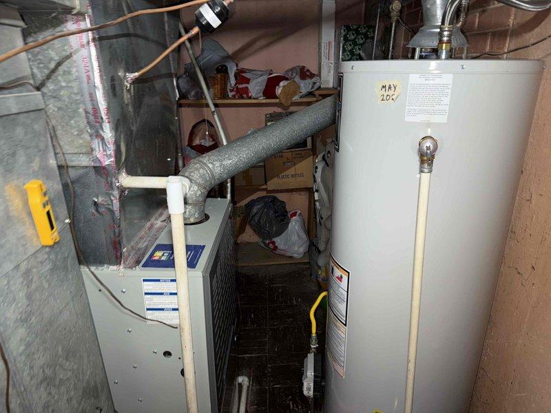 Completed spring maintenance clean and check on residential HVAC system per comfort plan agreement. Performed comprehensive inspection of furnace and air conditioning components, including cleaning of blower wheel assembly which showed moderate dust accumulation on fins and housing. Verified all mechanical components operational, inspected ductwork connections, and documented equipment condition with photos for service records.