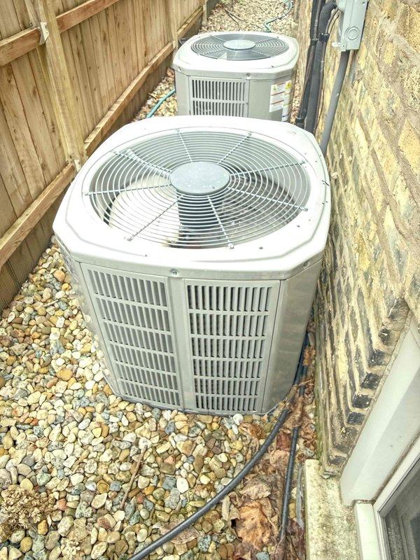 Completed comprehensive clean and check maintenance on two air conditioning systems per Comfort Plan agreement. Performed standard inspection procedures including temperature differential measurements, verified proper system operation, and documented equipment condition with photos. Inspected furnace door security as requested and confirmed proper closure; noted humidifier equipment present but not currently included in maintenance plan coverage.