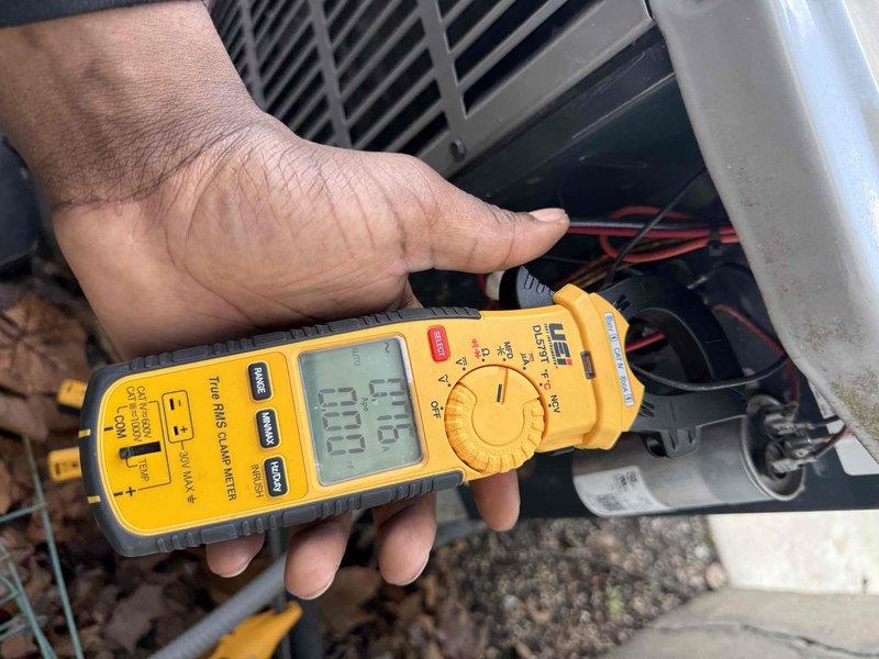 Completed comprehensive spring maintenance and clean-and-check service on two air conditioning systems per comfort plan agreement. Performed electrical diagnostics using digital multimeter and clamp meter, verifying amperage draws, voltage readings, and capacitor functionality on outdoor condenser units. Documented all equipment information with detailed photographs and confirmed systems are operating within manufacturer specifications for the cooling season.