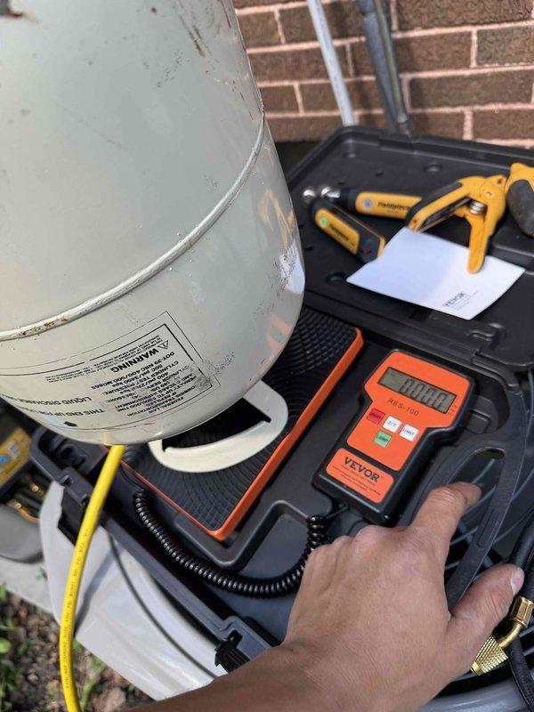 Performed warranty service on HVAC system by checking refrigerant pressures, adding refrigerant to bring system to proper charge levels, and applying EZ Seal leak sealant. System diagnostics completed and unit returned to normal operating parameters.