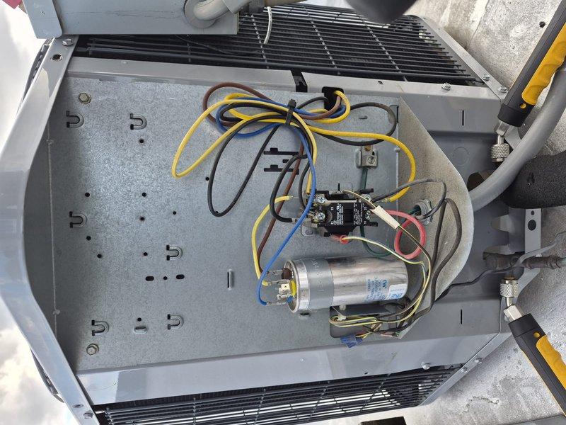 Completed comprehensive clean and check maintenance service on rooftop air conditioning system per Comfort Plan agreement. Accessed unit on upper roof level, performed full system inspection including electrical components, capacitor, contactor, and refrigerant lines, verified thermostat operation showing proper temperature control at 69°F, and confirmed all components are functioning properly with no visible signs of wear or deterioration.