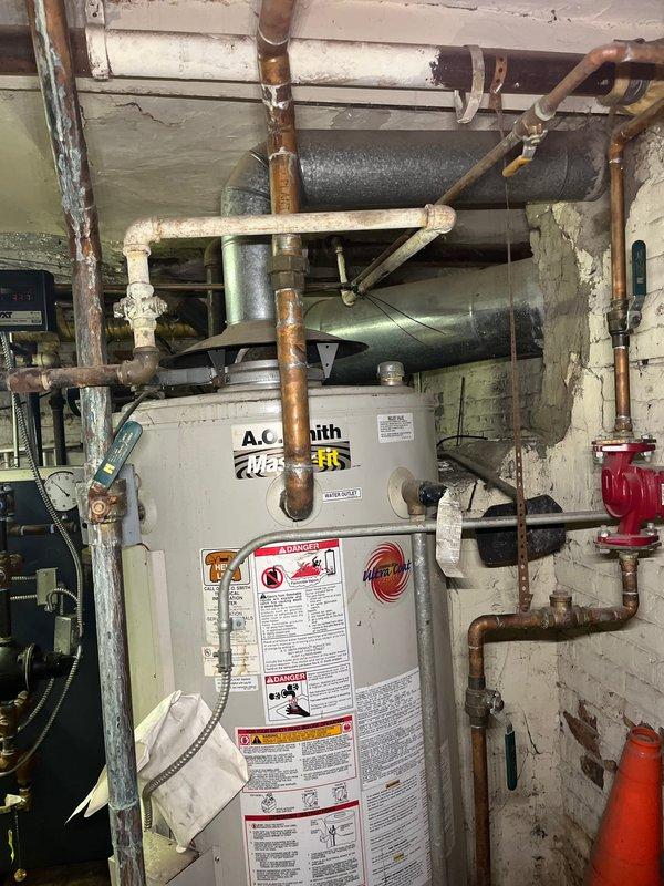 Conducted mini-split system consultation for residential property currently utilizing window air conditioning units. Assessed mechanical room containing existing water heater and plumbing infrastructure, as well as exterior building envelope to determine optimal placement for indoor and outdoor mini-split components. Provided estimate for ductless mini-split installation with available utility rebate program eligibility.