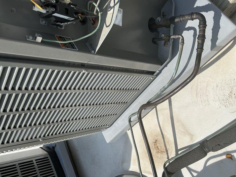 Completed spring tune-up and preventative maintenance on residential split system air conditioning unit. Performed comprehensive inspection of outdoor condensing unit and indoor air handler, cleaned condenser coils, checked refrigerant levels and electrical connections, verified proper system operation, and documented equipment condition with photos. Customer declined filter replacement as they maintain their own supply.