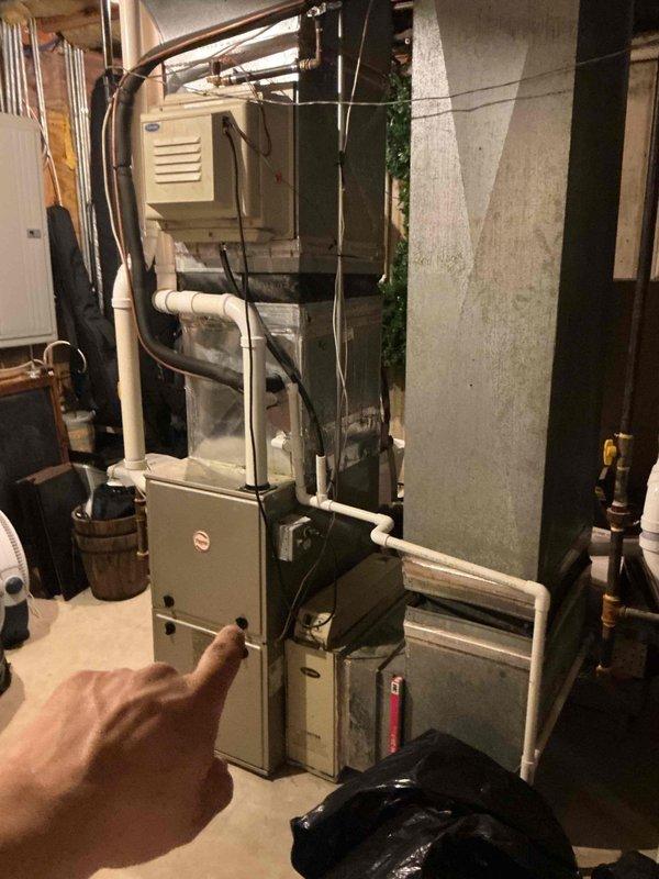 Performed seasonal air conditioning start-up and diagnosed condenser noise complaint on residential split system. Inspected Payne furnace with integrated cooling coil, verified refrigerant lines, condensate drainage system, and all associated PVC piping for proper operation. Identified noise source at outdoor condensing unit and completed necessary repairs to restore quiet operation. System tested and confirmed operating within normal parameters with proper airflow and temperature differential.