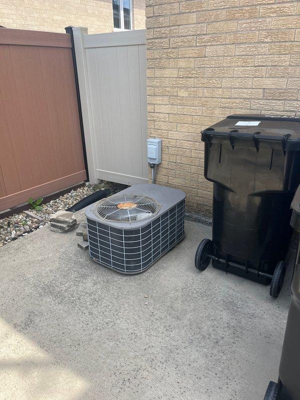 Conducted comprehensive estimate for replacement of residential air conditioning system for ranch-style home. Existing outdoor condenser unit is over 10 years old and requires full replacement. Evaluated current HVAC installation including outdoor AC condenser unit positioned on concrete pad adjacent to building exterior, and inspected indoor air handler/furnace system located in basement with existing PVC condensate drainage and venting infrastructure. Provided new customer with detailed replacement options and specifications for complete AC system upgrade.