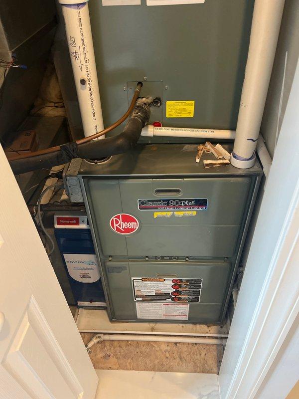 Responded to service call for non-operational air conditioning system with furnace blower and heating functioning properly. Evaluated existing Rheem Classic 90 Plus furnace and outdoor condensing unit, both over 15 years old. Diagnosed failed outdoor AC unit unable to engage when thermostat switched to cooling mode. Provided comprehensive system replacement estimate for new HVAC equipment to restore full heating and cooling functionality to the residence.