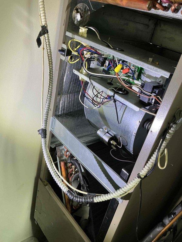 Completed comprehensive clean and check maintenance service on residential split system air conditioning unit and air handler per comfort plan agreement. Performed electrical diagnostics on outdoor condensing unit using digital multimeter to verify proper voltage and amperage readings across contactor and control circuits. Inspected all electrical connections, wire terminations, and safety controls within outdoor unit compartment. Evaluated indoor air handler assembly including blower motor, heat exchanger, and internal wiring harness for proper operation and condition. Verified thermostat functionality and system response as requested. All components found operating within manufacturer specifications with no deficiencies noted at time of service.