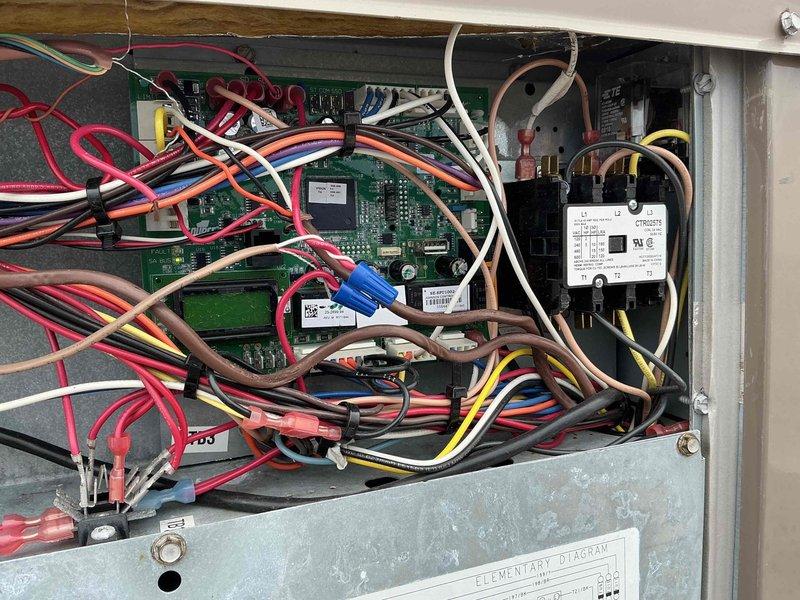 Responded to service call for rooftop unit serving hallway area with reported hot and stuffy conditions. Upon arrival, accessed rooftop equipment and performed diagnostic assessment of the non-operational RTU. Inspected electrical control panel, examining circuit boards, relay components, and associated wiring connections for proper operation. Identified control system issue preventing unit from operating correctly. Completed necessary repairs to restore cooling function to the affected hallway zone, ensuring proper airflow and temperature control were reestablished.