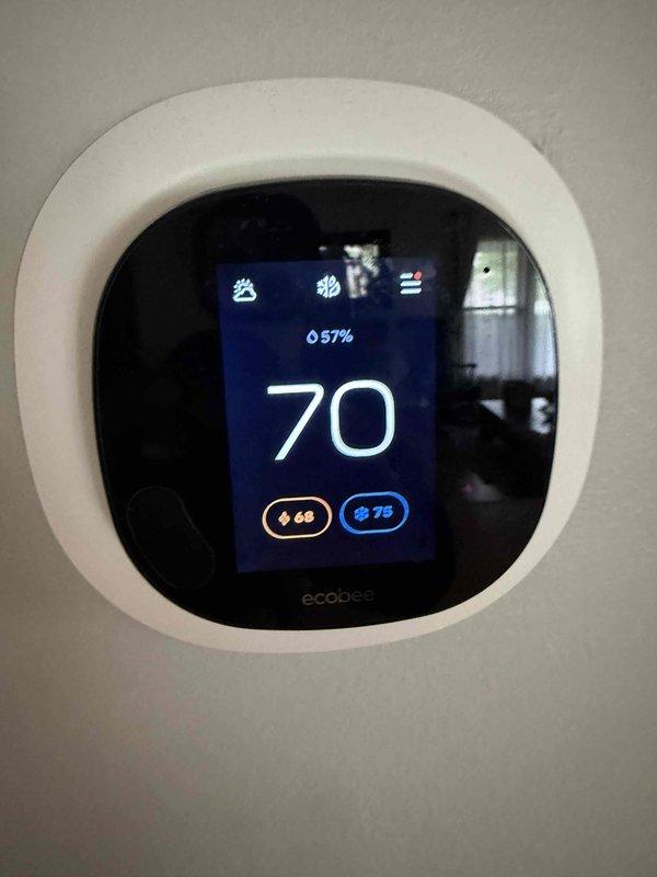 Completed comprehensive clean and check service on air conditioning system, electronic air cleaner, and whole-home humidifier as part of annual comfort plan maintenance. Performed electrical diagnostics using clamp meter to verify proper system operation and amperage draw. Confirmed ecobee smart thermostat functioning correctly with appropriate temperature and humidity readings displayed.