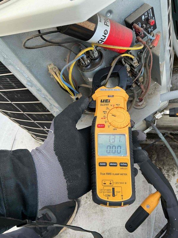 Performed comprehensive Clean and Check maintenance service on single HVAC system consisting of rooftop condenser unit and indoor air handler. Conducted electrical diagnostics using clamp meter, verified capacitor operation, inspected all wiring connections, and tested system performance. Documented equipment condition with photographs showing proper operation of all components, confirmed refrigerant line integrity, and verified air handler accessibility for future service needs.