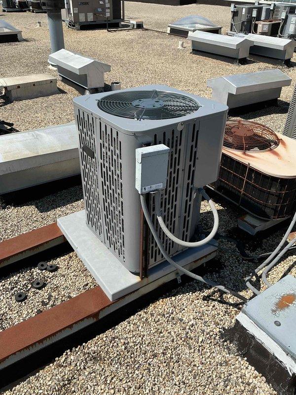Completed comprehensive clean and check maintenance service on rooftop air conditioning system and air handler unit as part of annual Comfort Plan agreement. Performed thorough inspection of condenser unit including electrical components, capacitor, contactor, and all associated wiring connections, verified proper operation of all mechanical and electrical systems, and documented equipment condition with photographic records.