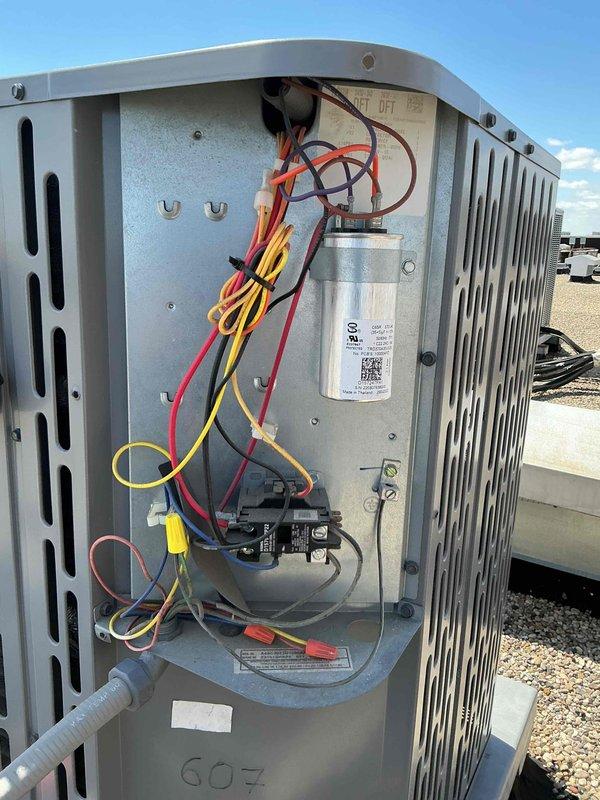 Completed comprehensive clean and check maintenance service on rooftop air conditioning system and air handler unit as part of annual Comfort Plan agreement. Performed thorough inspection of condenser unit including electrical components, capacitor, contactor, and all associated wiring connections, verified proper operation of all mechanical and electrical systems, and documented equipment condition with photographic records.
