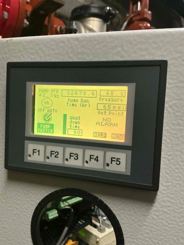 Responded to callback for non-operational pump affecting water supply to over 20 units. Upon arrival, performed electrical diagnostics using clamp meter to verify power supply and current draw at the control panel. Tested circuit breakers, terminal connections, and fuse integrity within the electrical enclosure. Inspected pump controller display showing UFD (Under Frequency Detection) fault condition and verified pump run status, switch operations, and system parameters. Troubleshot control sequences and monitored operational readings to identify root cause of recurring pump failure. System restored to proper operation with all parameters within normal range.