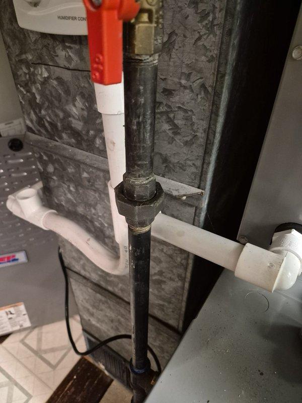 Responded to emergency service call for gas furnace that had been shut down by utility company due to detected gas leak. Upon arrival, performed comprehensive leak detection inspection of 2-3 year old gas furnace system, including all gas line connections, threaded fittings, and shut-off valves. Located leak at gas supply connection point near furnace unit. Tightened compromised threaded fitting and replaced faulty gasket at connection. Performed pressure test on gas line to verify integrity of repair. Conducted combustion analysis and verified proper gas valve operation. Inspected condensate drain system and PVC drainage lines for proper function. Restored gas supply, performed ignition sequence test, and monitored furnace through complete heating cycle. Confirmed no gas leaks present using electronic leak detector at all connections and fittings. Verified proper airflow through ductwork and checked all safety controls for proper operation. System returned to safe, normal operation wi
