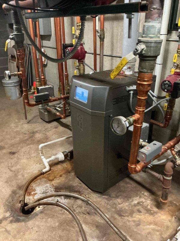 Responded to customer request to transition HVAC system from heating to cooling mode for the season. Located boiler control switches in mechanical room and shut down heating system operation. Verified boiler unit powered down properly and documented existing system configuration including hydronic heating equipment, expansion tanks, and associated copper piping infrastructure. Confirmed cooling system ready for activation and operation. System successfully transitioned per customer specifications with all mechanical components photographed for service records.