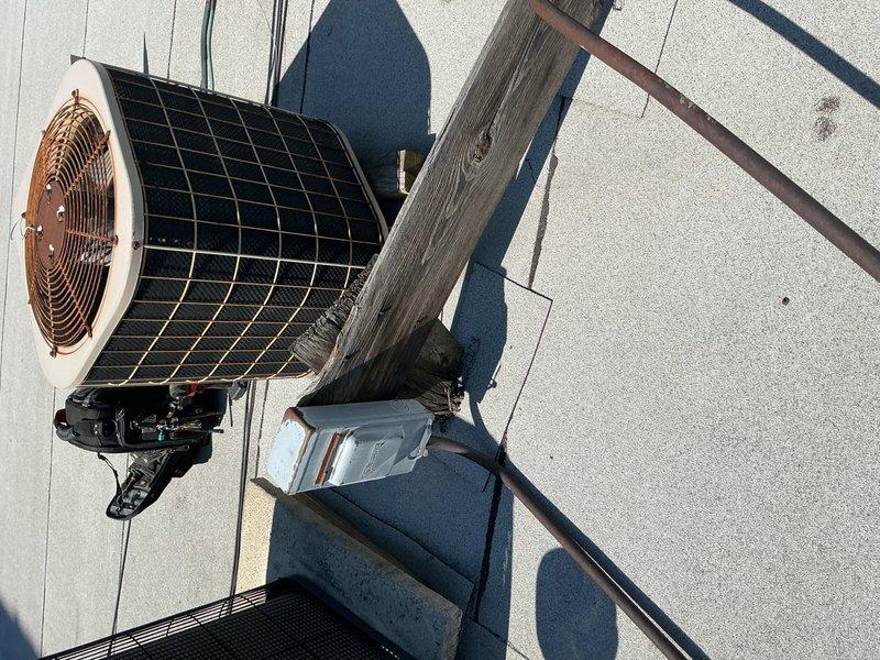 Completed preventative maintenance clean and check on rooftop air conditioning system per Comfort Plan agreement. Performed comprehensive inspection of outdoor condensing unit including coil cleaning, electrical connections check, and refrigerant level verification. Confirmed thermostat operation and system cooling to setpoint of 69°F with proper cycle timing.