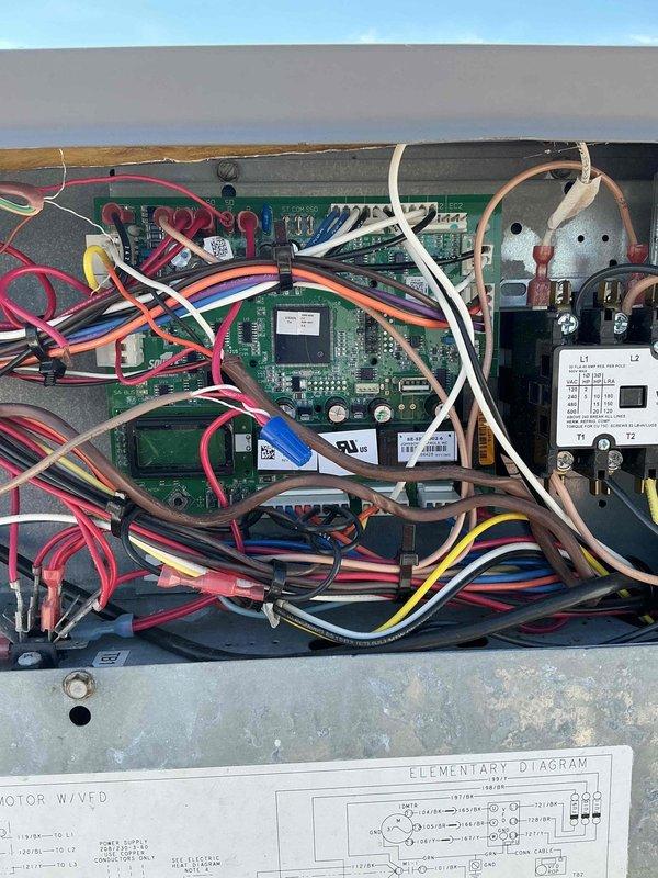 Replaced failed circuit board on rooftop unit (RTU). Removed defective green PCB control board from metal enclosure and installed new replacement board. Reconnected all wiring harnesses including power connections, control wiring, and communication cables to proper terminals on new circuit board. Verified all wire connections were secure at terminal blocks and connectors. Tested system operation after board replacement to confirm proper function of RTU controls and variable frequency drive (VFD) motor operation. Collected outstanding balance on invoice.