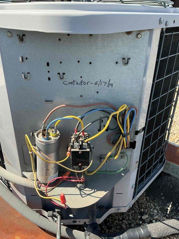 Completed spring preventive maintenance on commercial HVAC system including two rooftop units and indoor air handler. Responded to service calls for loud noise from West RTU and cooling issues on East RTU. Performed diagnostic testing on electrical components including capacitor testing with multimeter, recording readings of 4053 on West unit capacitor. Conducted clean and check procedures on both York rooftop units, replaced all air filters per maintenance agreement specifications (14x25x1 and 14x20x1 sizes as required for each unit), and performed filter change only on York furnace in mechanical room. Inspected electrical connections, contactors, relays, and condensate drainage systems on both RTUs. Documented equipment conditions and component markings for service records.
