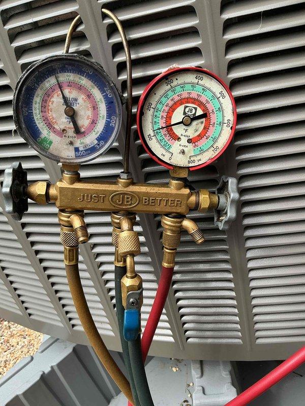 Performed warranty follow-up on recently installed HVAC system to verify proper refrigerant charge and system operation. Connected manifold gauge set to service ports and confirmed operating pressures were within manufacturer specifications for optimal performance and efficiency.