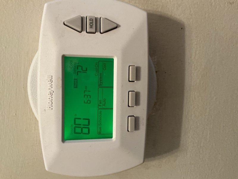 Completed comprehensive tune-up maintenance on single HVAC system including air conditioning unit and air handler. Performed cleaning and check procedures on both AC condenser and air handler components, inspected blower wheel assembly which showed dust accumulation on housing and fan blades, and replaced air filter. Verified thermostat operation with Honeywell digital unit displaying proper temperature reading of 72°F and confirmed system holding set temperature correctly.