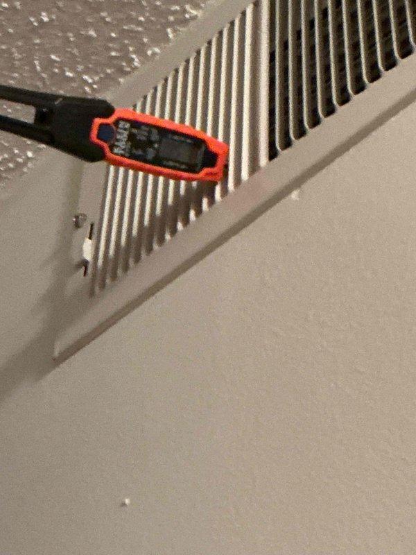 Performed routine maintenance tune-up on residential air conditioning system with air handler. Conducted comprehensive cleaning and check of both units, replaced air filter, and verified system operation with temperature readings at evaporator coil. Both outdoor condensing units inspected and confirmed operational with proper airflow through top-mounted fan grilles.
