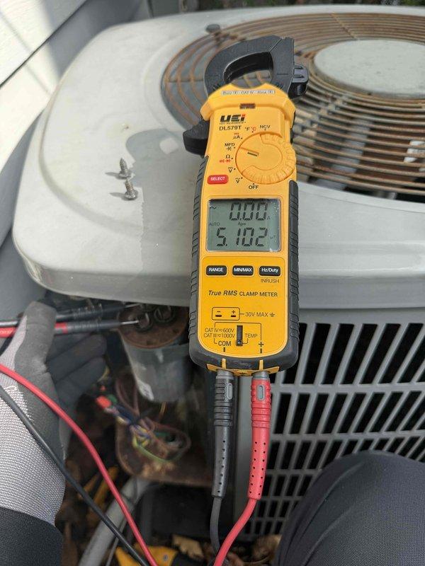 Completed spring preventative maintenance and clean and check on air conditioning system per service contract plan. Performed comprehensive inspection of outdoor condensing unit, including electrical components, capacitor testing with digital multimeter, and assessment of overall system condition. Noted rust accumulation on base plate and debris buildup in unit compartment; cleaned accessible areas and documented equipment condition with diagnostic readings for service records.