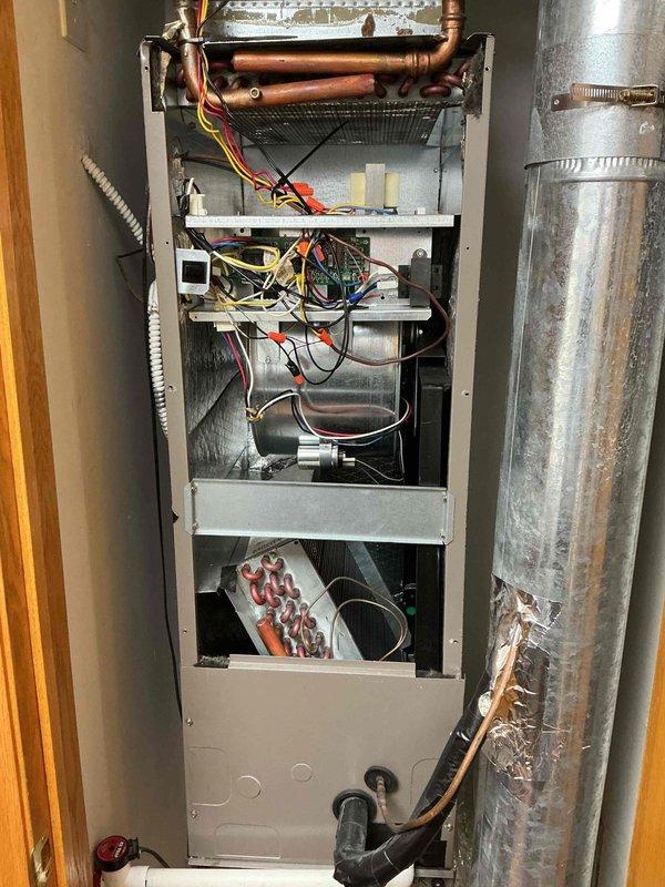 Completed comprehensive tune-up maintenance on residential air conditioning and air handler system. Performed clean and check procedures on all major components, inspected evaporator coil, refrigerant lines, electrical connections, and blower assembly. Replaced air filter and verified thermostat operation showing proper temperature control at 76 degrees.