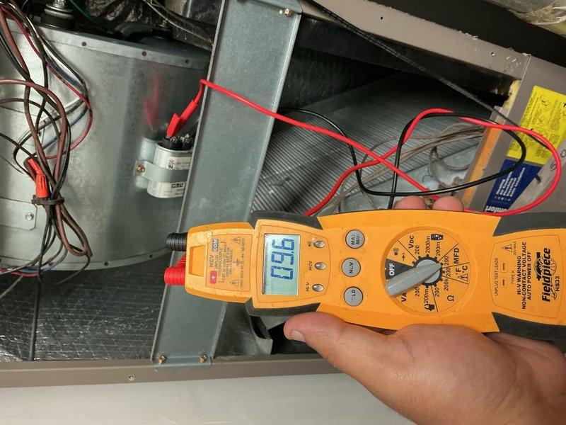 Completed comprehensive tune-up on single HVAC system including air conditioning unit and air handler. Performed electrical diagnostics using digital multimeter to verify capacitor performance and system operation, confirming 40 MFD 450 VAC capacitor within acceptable parameters. Supplied and installed replacement air filter per customer request to ensure proper airflow and system efficiency.