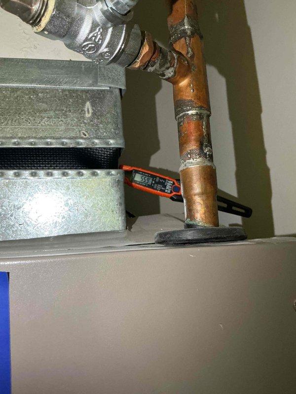 Completed comprehensive tune-up and inspection on single-system HVAC unit including air conditioning condenser and air handler. Performed clean and check procedures on all major components, inspected electrical connections and wiring, examined heat exchanger and blower assembly, and replaced air filter. All copper refrigerant lines, control board connections, and mechanical components were visually inspected and found to be operational, with minor oxidation noted on copper piping consistent with normal aging.