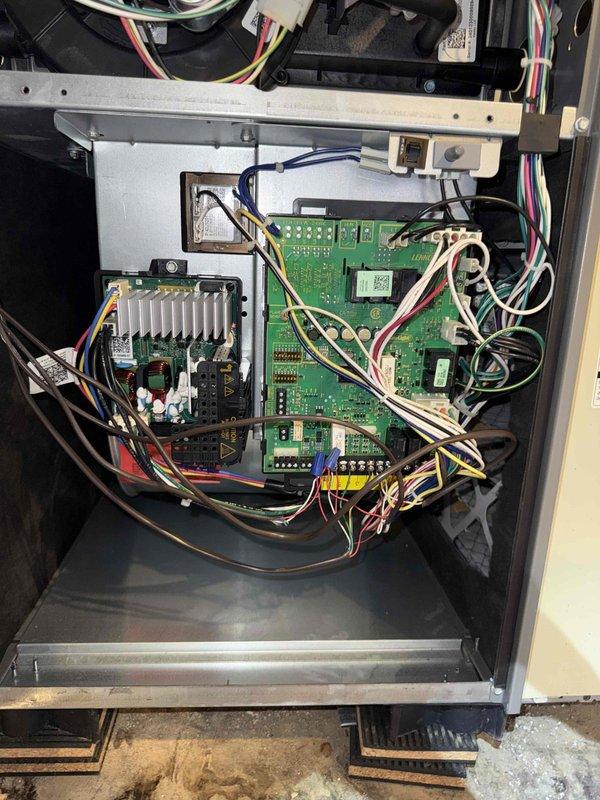 Completed spring preventative maintenance on air conditioning system per comfort plan agreement. Performed thorough clean and check procedures including inspection of control board, wiring connections, and outdoor disconnect components. Verified all electrical connections secure, tested system operation, and documented equipment condition with photos showing control board with proper wire management and outdoor disconnect housing with TITAN contactor in serviceable condition.