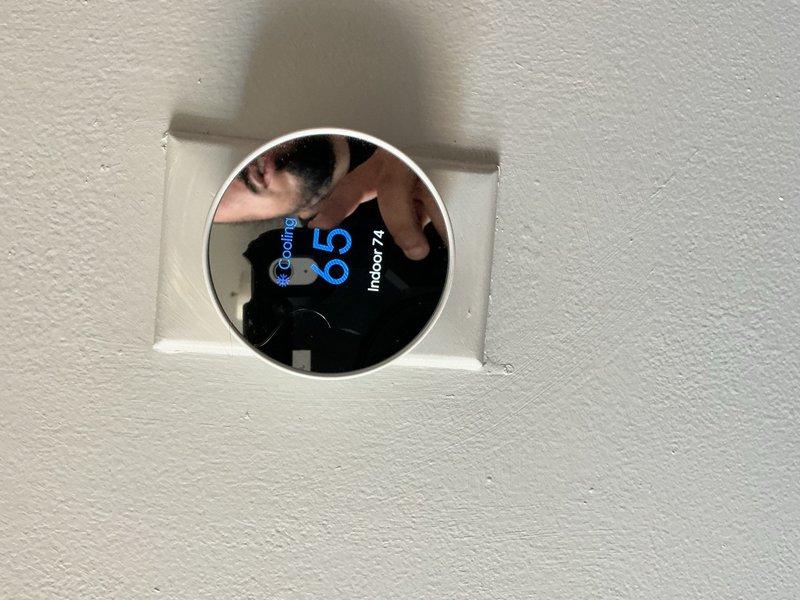Completed comprehensive tune-up maintenance on residential air conditioning system and air handler. Performed cleaning and check procedures on both units, replaced air filter, and verified system operation with thermostat set to cooling mode at 65°F with indoor temperature reading 74°F. Conducted electrical diagnostics using digital multimeter to ensure proper voltage and system performance.