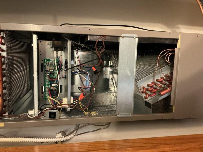Performed routine maintenance on residential air conditioning system including clean and check of air handler and condensing unit. Replaced air filter and completed standard tune-up procedures. During inspection, identified capacitor with significant corrosion and mineral buildup requiring attention. Documented internal components showing dust accumulation on evaporator coil and electrical connections. System operational at time of service completion.