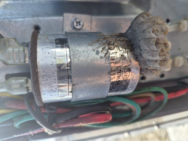 Performed routine maintenance on residential air conditioning system including clean and check of air handler and condensing unit. Replaced air filter and completed standard tune-up procedures. During inspection, identified capacitor with significant corrosion and mineral buildup requiring attention. Documented internal components showing dust accumulation on evaporator coil and electrical connections. System operational at time of service completion.