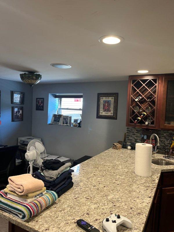Conducted on-site assessment for a two-flat residential building to provide HVAC estimate for replacing existing window air conditioning units with permanent central air conditioning systems. Evaluated the first floor/basement level and second floor units to determine optimal equipment placement, ductwork routing, and system sizing requirements for two separate HVAC systems as requested by the property owner. Documented existing conditions of finished basement living space including kitchen area, bedrooms, and hallway to plan installation logistics and ensure minimal disruption to completed interior finishes.