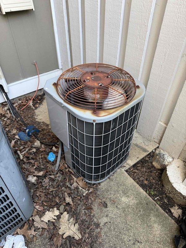 Completed comprehensive clean and check maintenance service on air conditioning system per comfort plan agreement. Performed standard inspection of outdoor condenser unit, noting significant rust accumulation on top panel around fan guard assembly and debris buildup around equipment base. Evaluated water heater manufactured in 2010, which has exceeded typical 8-10 year service lifespan and likely contains substantial sediment accumulation reducing operational efficiency. Discussed replacement options with property owner, including conventional tank-style units and tankless water heater alternatives for consideration. All system components checked and serviced according to maintenance protocol.