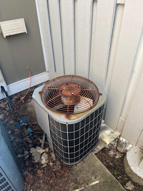 Completed HVAC estimate for air conditioning system replacement. Assessed existing outdoor condenser unit showing significant rust deterioration on top panel and fan guard area, along with indoor air handler and ductwork system in basement utility area. Also evaluated 2010 water heater that has exceeded typical lifespan and likely contains sediment buildup affecting efficiency, providing replacement options including traditional tank and tankless configurations for customer consideration.