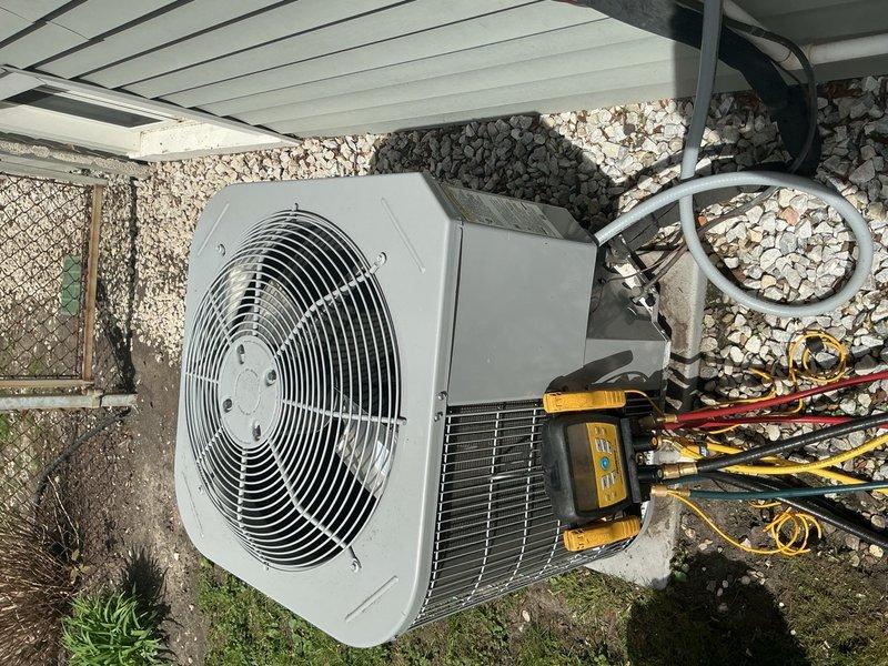 Returned to site to verify refrigerant charge levels on recently installed complete HVAC system and investigate reported second-floor leak. Connected digital manifold gauges to outdoor condensing unit service ports and performed comprehensive refrigerant analysis, confirming proper charge and system pressures. Conducted thorough inspection of refrigerant line connections, service valves, and copper line routing along exterior wall to identify source of second-floor moisture issue.