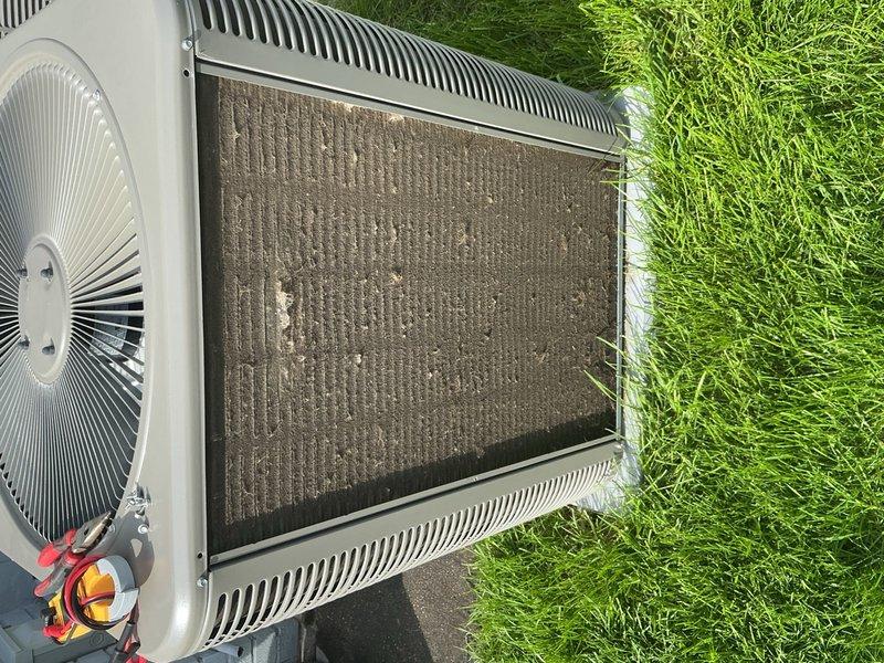 Completed spring maintenance clean and check on outdoor air conditioning condenser unit and mini-split system per Good Contractor Practice standards. Inspected heat exchanger coils which showed moderate accumulation of dirt, debris, and particulate matter between fins; cleaned condenser coils to restore proper airflow and heat transfer efficiency. Performed comprehensive system evaluation including fan operation, refrigerant connections, and overall unit condition to ensure optimal performance for the cooling season.