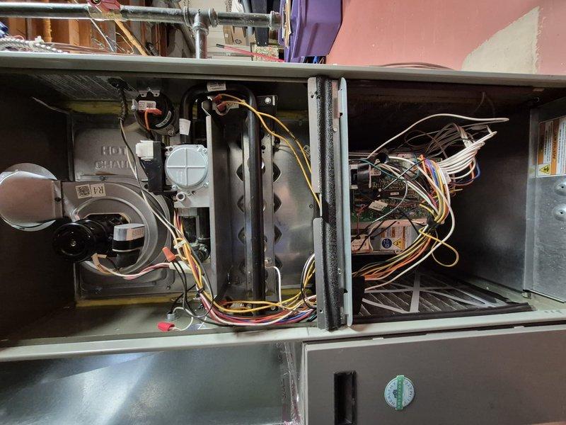 Completed annual air conditioning clean and check maintenance per Comfort Plan agreement. Performed comprehensive system inspection of furnace and evaporator coil assembly, documenting existing dust and debris accumulation on coil fins. Inspected all electrical connections, control board, blower motor assembly, refrigerant lines, and condensate management components to ensure proper system operation and identify any maintenance concerns.