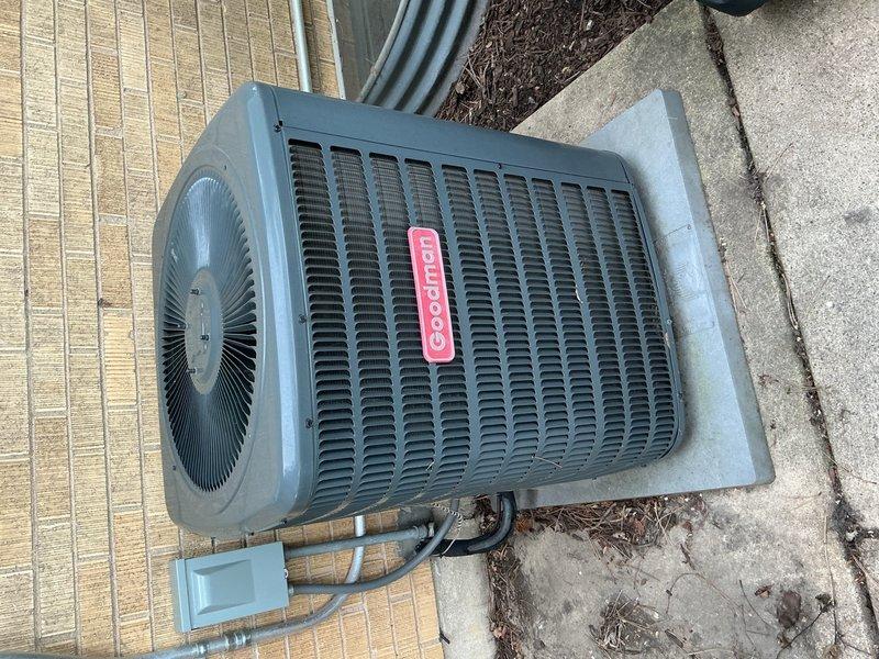 Completed comprehensive air conditioning tune-up on Goodman condensing unit system. Performed electrical diagnostics with multimeter confirming proper voltage at 71.5V, inspected all refrigerant line connections and insulation integrity, verified fan assembly operation, and conducted complete system assessment of both indoor and outdoor components. All equipment found operating within normal parameters with no immediate concerns noted.