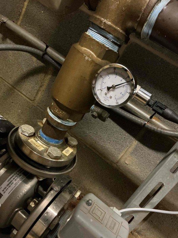 Responded to commercial plumbing service call to inspect and evaluate booster pump system. Upon arrival, conducted thorough assessment of the existing pump assembly, including pressure monitoring equipment, motor operation, and associated piping connections. Documented system configuration with pressure gauge readings and overall mechanical condition of the installation for maintenance records and future reference.