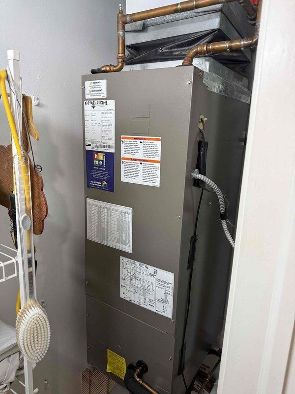 Responded to no cooling complaint with indoor temperature not reaching below 75 degrees. Performed diagnostic inspection of residential air handler unit, accessing internal components including control board, capacitor, and refrigeration connections. Documented system configuration and current operating conditions with detailed photography of electrical components, wiring harnesses, and evaporator coil assembly for further analysis and service recommendations.