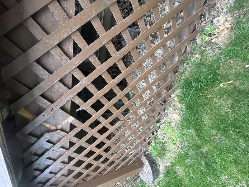 Conducted on-site evaluation of existing 30-year-old air conditioning system for replacement estimate. Inspected outdoor condensing unit located behind lattice screening at building exterior and assessed indoor air handler components including ductwork connections and system infrastructure. Documented current equipment configuration, mounting locations, and existing installation parameters to provide comprehensive replacement recommendations and sizing requirements for new AC system installation.