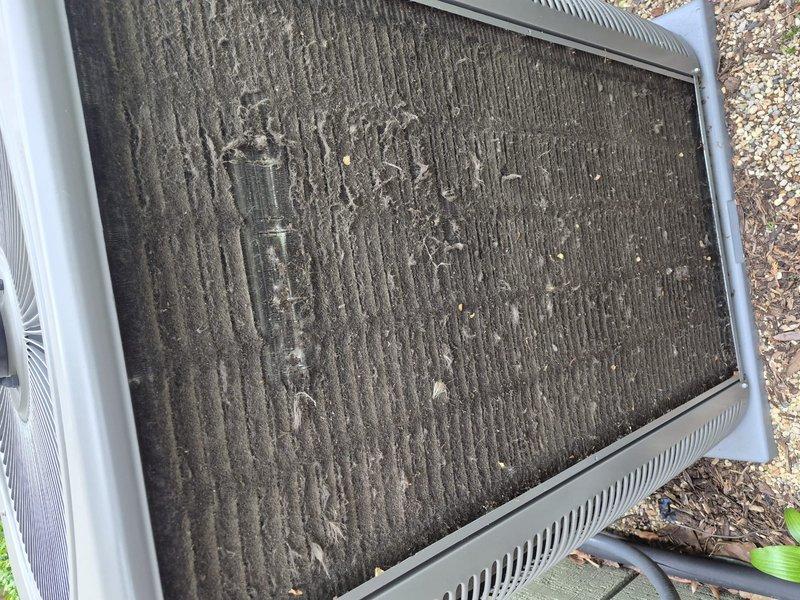 Completed comprehensive clean and check maintenance on air conditioning system per comfort plan agreement. Inspected all major components, replaced heavily soiled air filter that showed significant dust and debris accumulation, and verified system operation under current weather conditions with ambient temperature at 69°F.