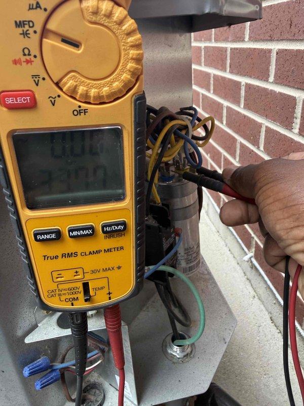 Completed comprehensive clean and check maintenance service on air conditioning system per comfort plan agreement. Performed electrical diagnostics using clamp meter to verify capacitor performance and measure voltage and amperage readings on outdoor condensing unit. All electrical components tested within manufacturer specifications and system operating properly.