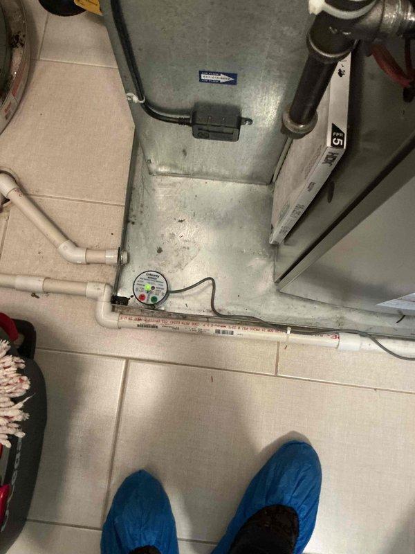 Responded to warranty call for non-operational air conditioning system where thermostat was calling but unit failed to respond. After consultation with technical support and diagnostic testing, identified voltage bleed back issue caused by original 18/8 wiring installation. Replaced wiring with 18/2 wire and rewired the RDS, EIM, and furnace board to eliminate voltage interference. Upon testing AC operation post-rewiring, thermostat experienced power dropout, indicating possible undersized transformer unable to handle system load. Documented findings with photos of HVAC equipment and control panel components. Recommended follow-up visit with senior technician to address transformer capacity issue and complete system commissioning.